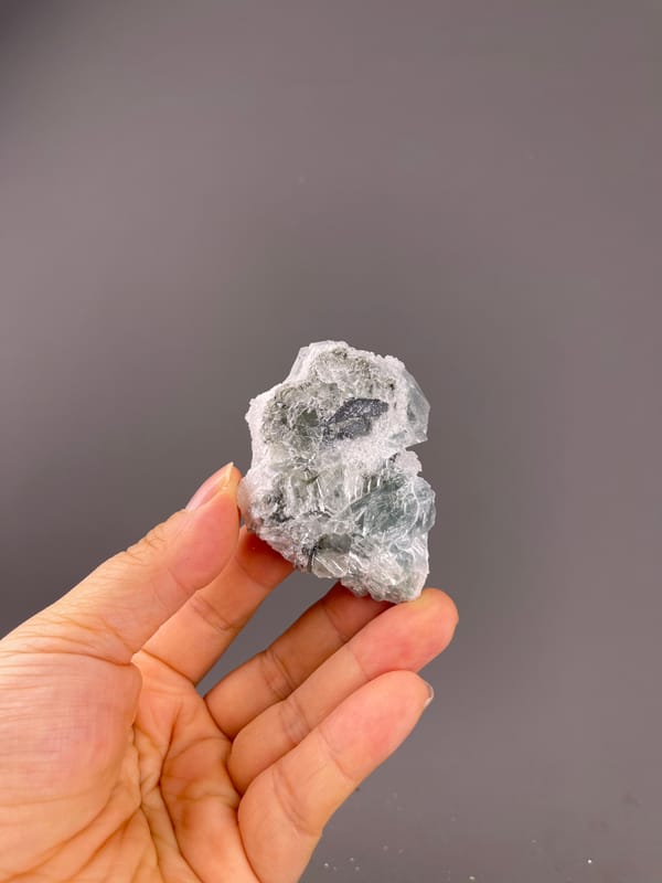 Fluorite from Fujian, China: small reverse cavity within white-coated matrix.