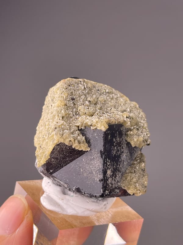 Fluorite from Fujian, China: coated reverse with a dark lower corner.