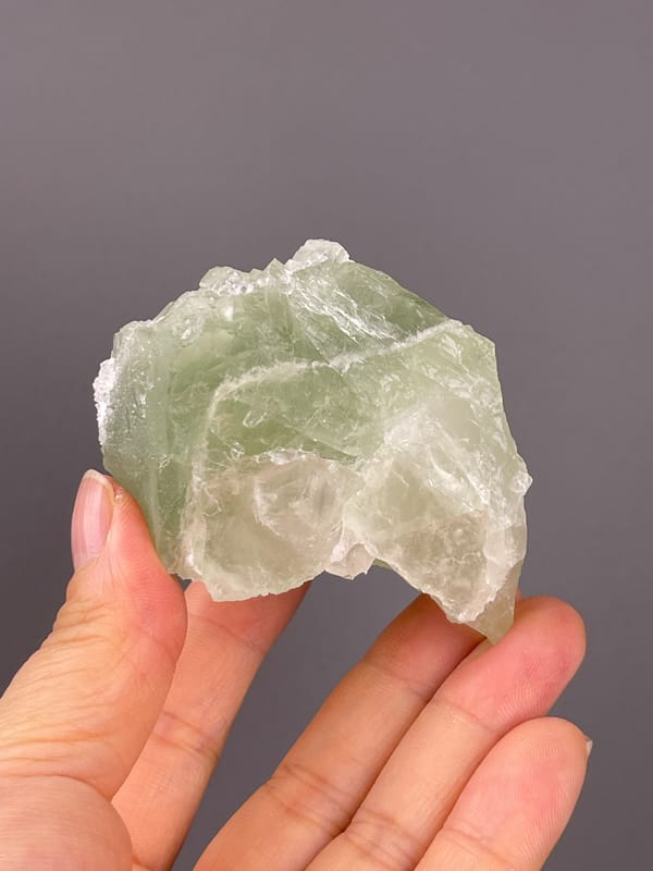 Fluorite from Fujian, China: reverse with broad translucent green surfaces.