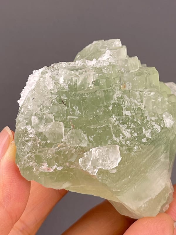 Fluorite from Fujian, China: close view of green faces and white patches.