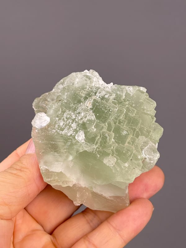 Fluorite from Fujian, China: upper face with pale green interlocking steps.
