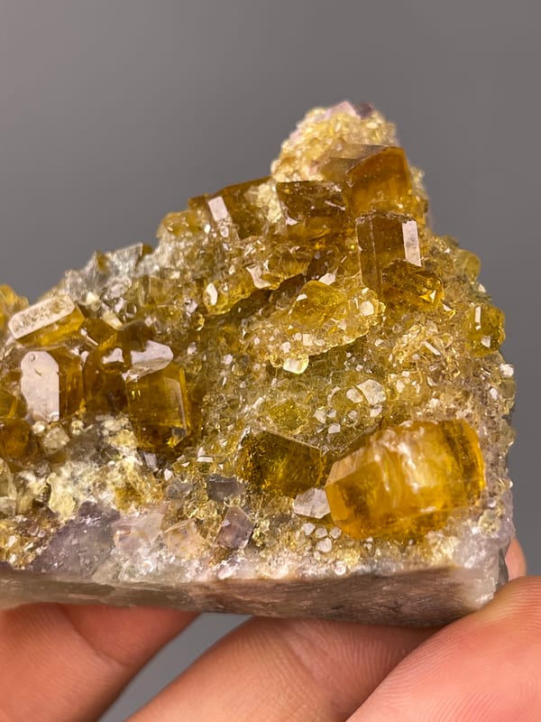 Fluorite with Yellow Barite specimen from Jiangxi, China presenting honey-yellow barite crystals on fluorite