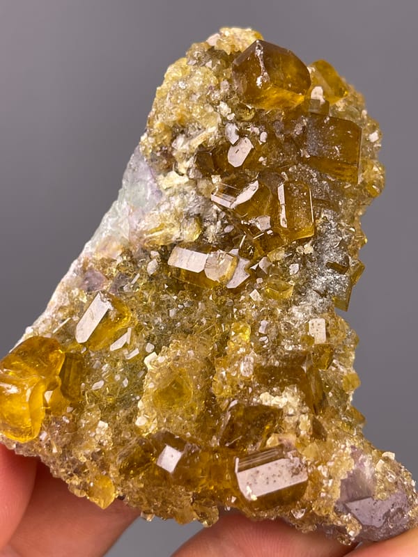 Fluorite with Yellow Barite specimen from Jiangxi, China defined by honey-yellow barite crystals on fluorite