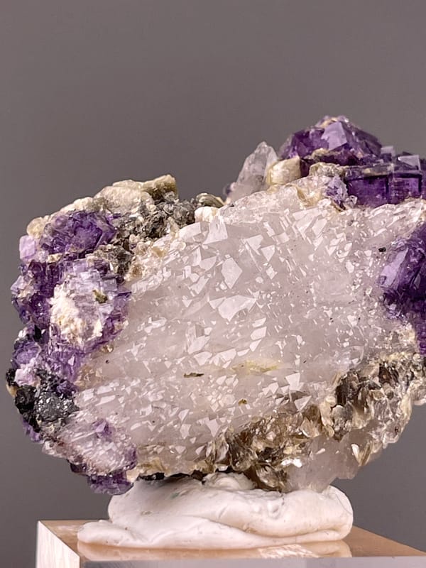 Fluorite from Yaogangxian, Hunan, China: purple crystals beside finely textured white quartz.