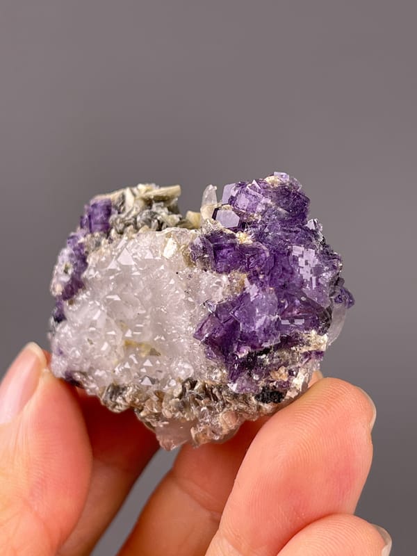 Fluorite from Yaogangxian, Hunan, China: tilted front view showing purple and silvery margins.