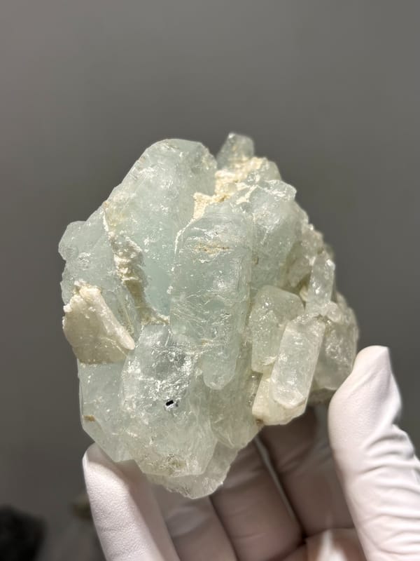 Frosted pale green aquamarine block from Xuebaoding, Sichuan, China, close-up of the crystal faces