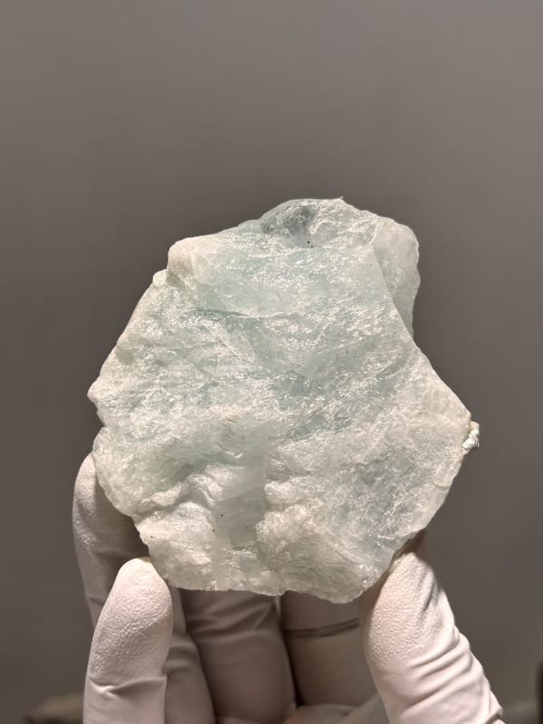 Large frosted pale aquamarine block from Xuebaoding, Sichuan, China, close-up of the crystal faces