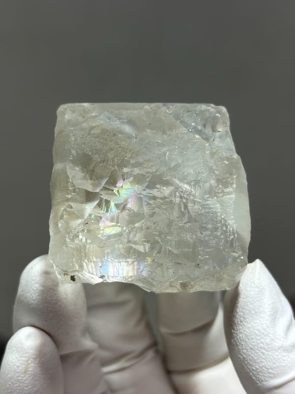 Frosted white fluorite cube from Xuebaoding, Sichuan, China, close-up of the crystal faces