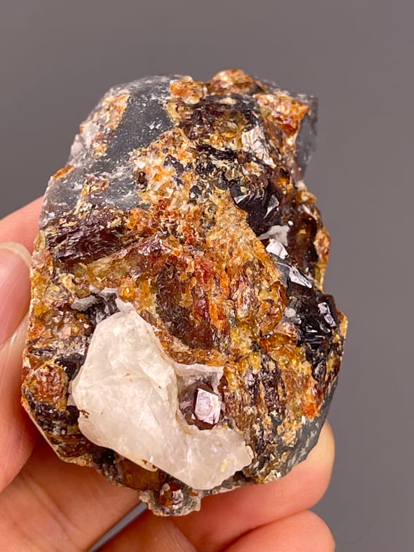 Garnet from Yunxiao, Fujian, China: upper surface with scattered brown faceted crystals.