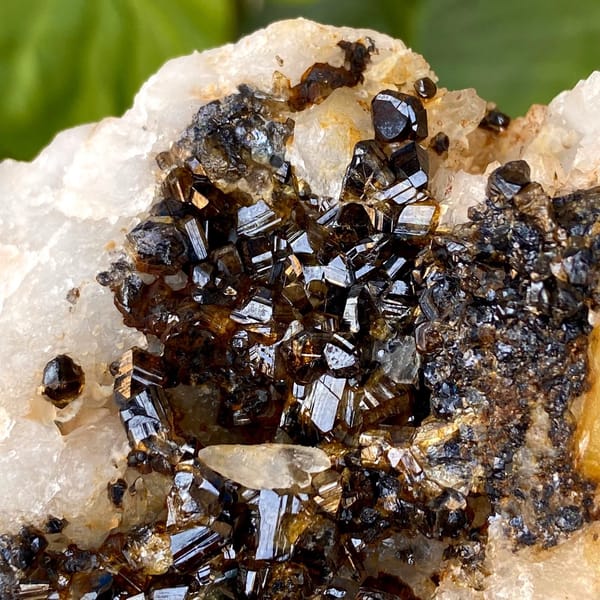 Plate of gemmy brown cassiterite on white quartz from Yunnan, China, view 2 of 9