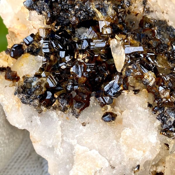 Plate of gemmy brown cassiterite on white quartz from Yunnan, China, view 4 of 9