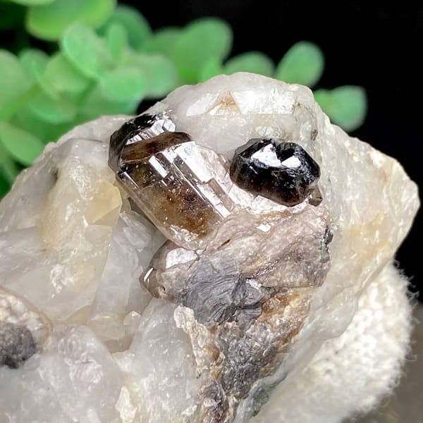 Gemmy brown cassiterite crystal on white quartz from Yunnan, China, view 2 of 9