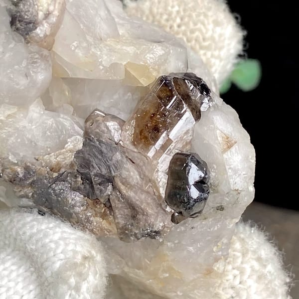 Gemmy brown cassiterite crystal on white quartz from Yunnan, China, view 3 of 9
