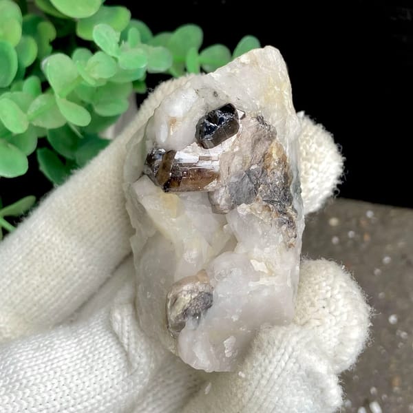 Gemmy brown cassiterite crystal on white quartz from Yunnan, China, view 5 of 9
