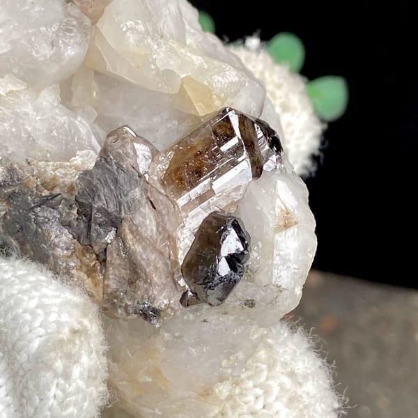 Gemmy brown cassiterite crystal on white quartz from Yunnan, China, view 7 of 9