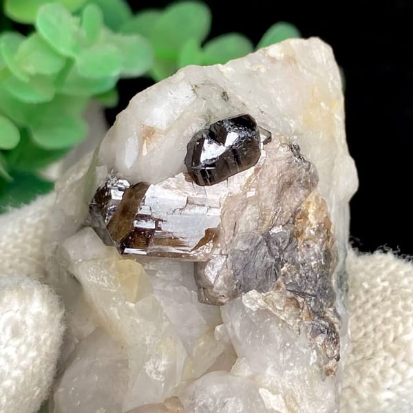 Gemmy brown cassiterite crystal on white quartz from Yunnan, China, view 8 of 9