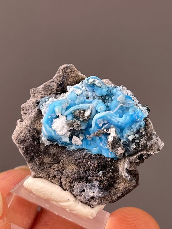 Gibbsite specimen from Guizhou, China highlighting bright blue botryoidal cavity