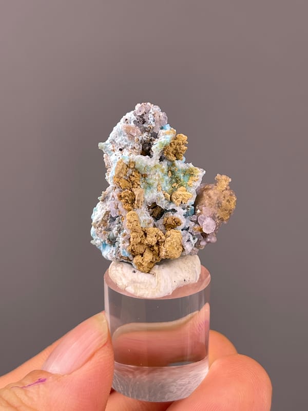 Gibbsite specimen from Qinglong, Guizhou, China, defined by blue-pink botryoidal material with yellow matrix