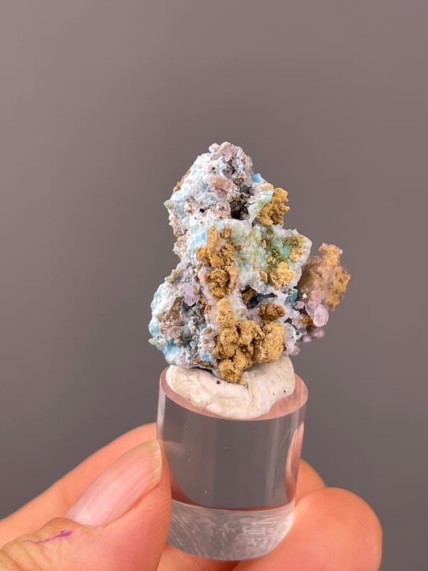 Gibbsite specimen from Qinglong, Guizhou, China presenting blue-pink botryoidal material with yellow matrix