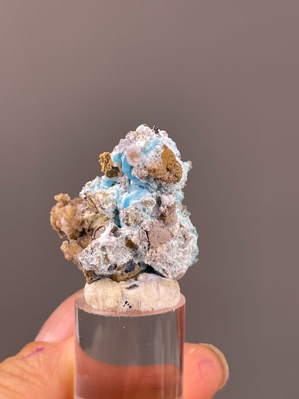 Blue-pink botryoidal material with yellow matrix visible on gibbsite specimen from Qinglong, Guizhou, China