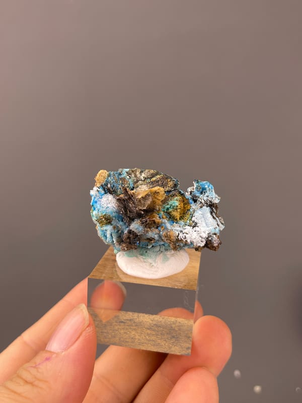 Pale blue fibrous material with white druse on natural gibbsite specimen from Qinglong, Guizhou, China