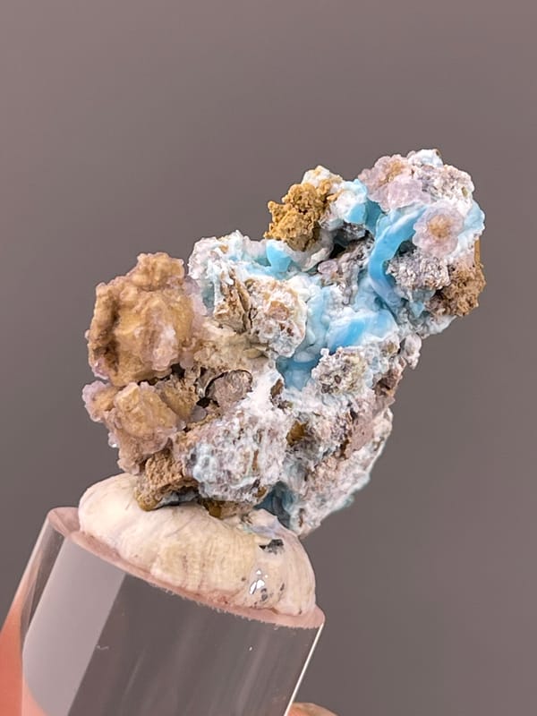Gibbsite specimen from Qinglong, Guizhou, China highlighting blue-pink botryoidal material with yellow matrix