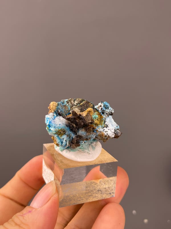 Gibbsite specimen from Qinglong, Guizhou, China highlighting pale blue fibrous material with white druse