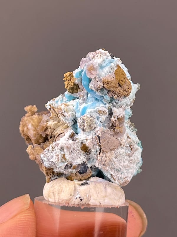 Gibbsite specimen from Qinglong, Guizhou, China, characterized by blue-pink botryoidal material with yellow matrix
