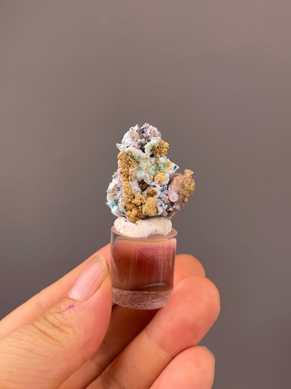 Gibbsite specimen from Qinglong, Guizhou, China bearing blue-pink botryoidal material with yellow matrix
