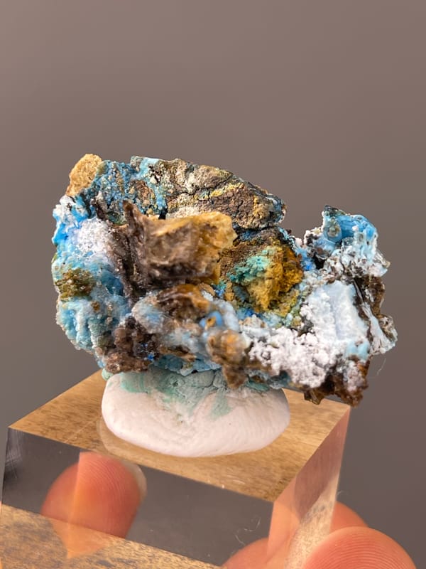Gibbsite specimen from Qinglong, Guizhou, China bearing pale blue fibrous material with white druse