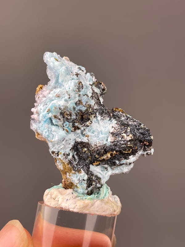 Gibbsite specimen from Qinglong, Guizhou, China bearing pale blue botryoidal crust on brown matrix