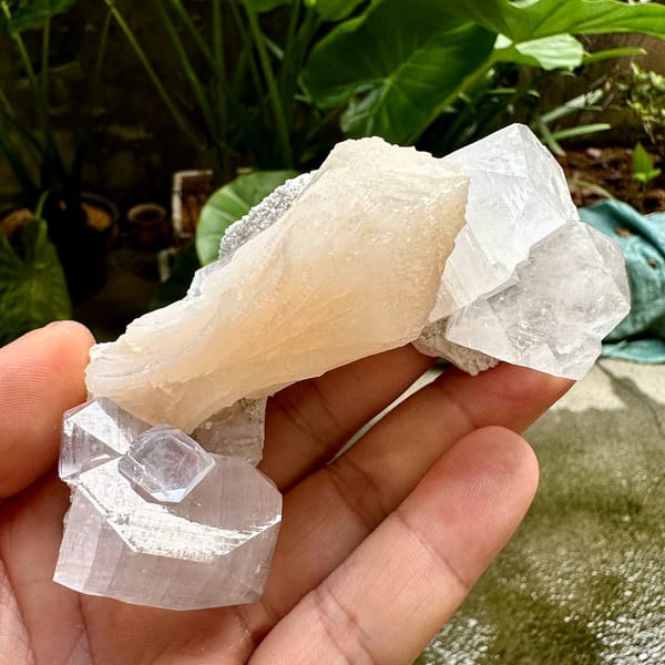Glassy apophyllite crystals with peach stilbite from India, view 4 of 6