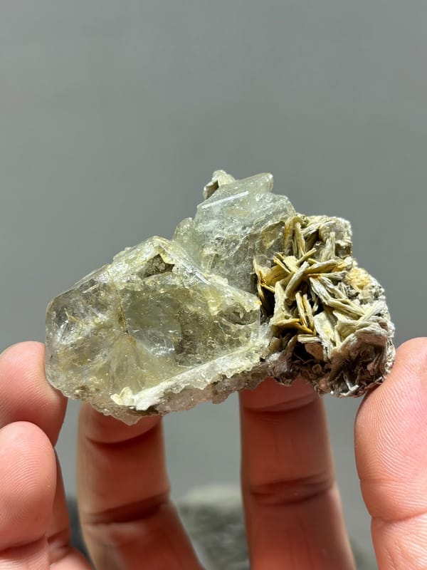 Glassy aquamarine with iridescent faces and mica from Xuebaoding, Sichuan, China, view 2 of 5