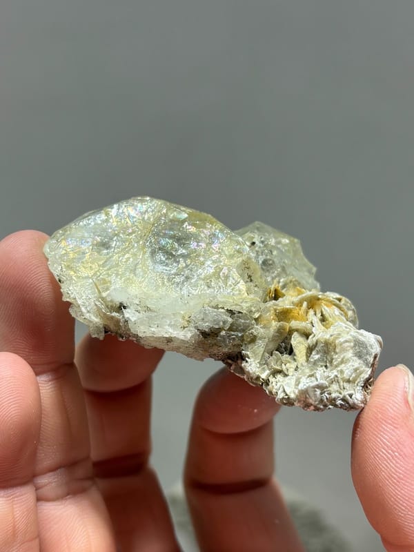 Glassy aquamarine with iridescent faces and mica from Xuebaoding, Sichuan, China, view 3 of 5