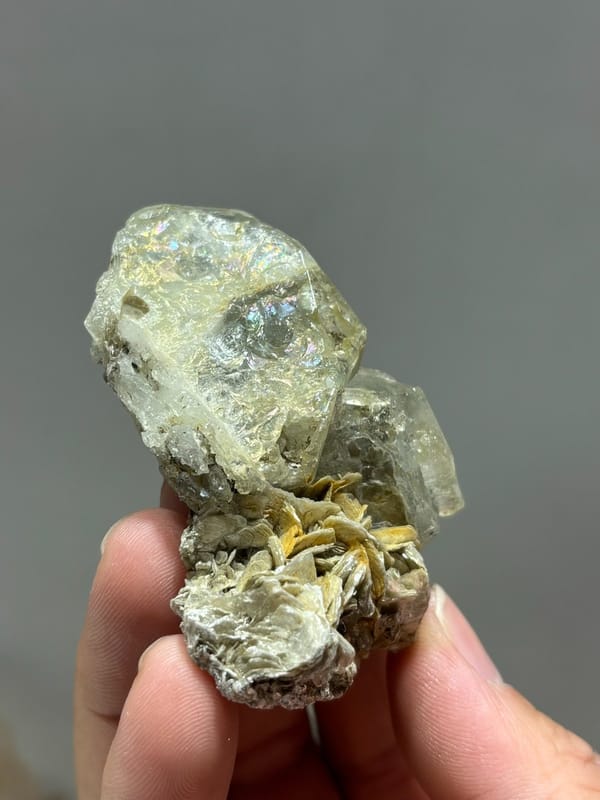 Glassy aquamarine with iridescent faces and mica from Xuebaoding, Sichuan, China, view 4 of 5