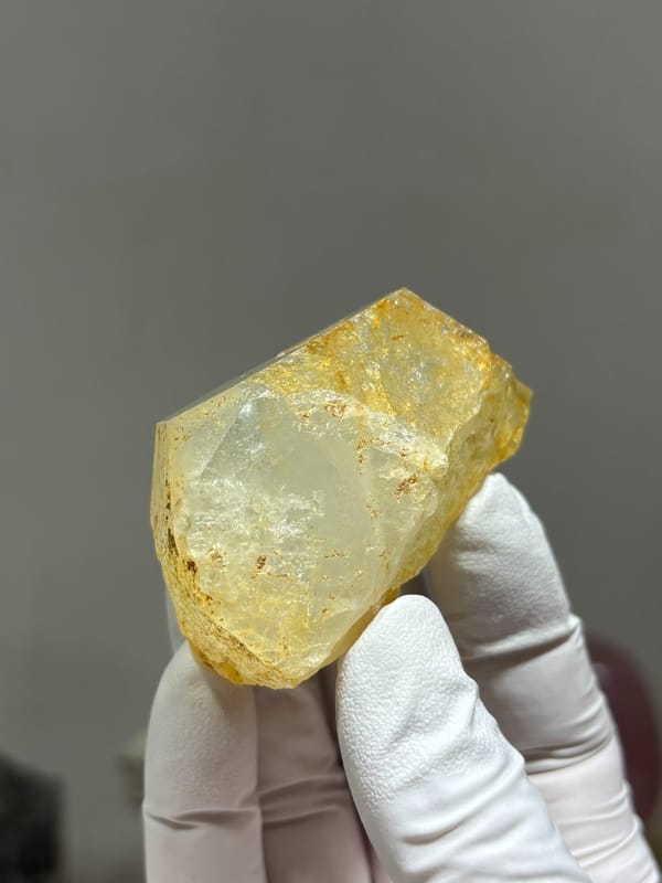 Glassy pale aquamarine wedge with golden inclusions from Xuebaoding, Sichuan, China, view 6 of 6