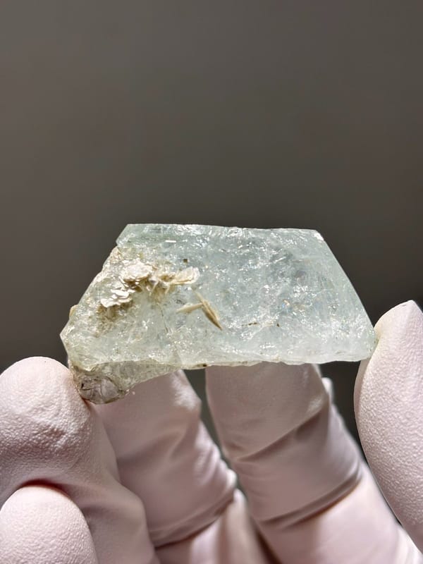Glassy pale aquamarine with mica fleck from Xuebaoding, Sichuan, China, view 4 of 5
