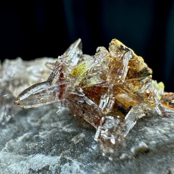 Glittering creedite flakes on grey rock from Guizhou, China, view 3 of 6