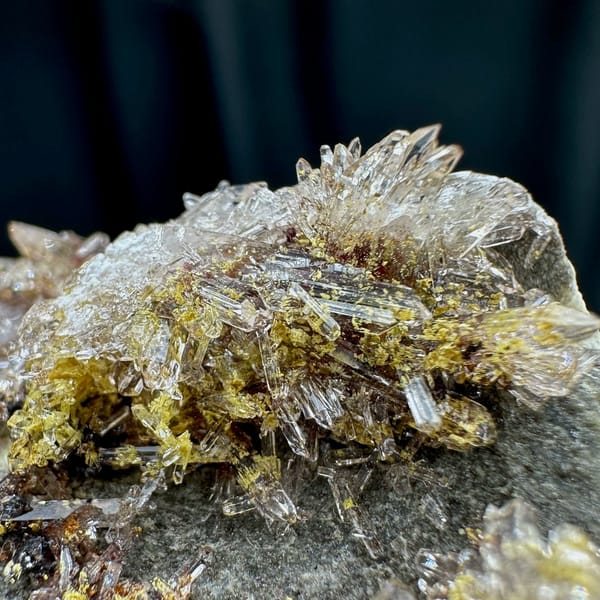 Glittering creedite flakes on grey rock from Guizhou, China, view 4 of 6