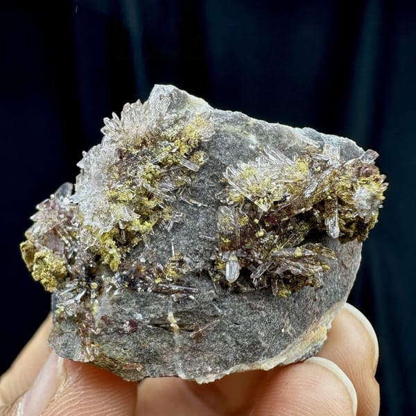 Glittering creedite flakes on grey rock from Guizhou, China, view 6 of 6