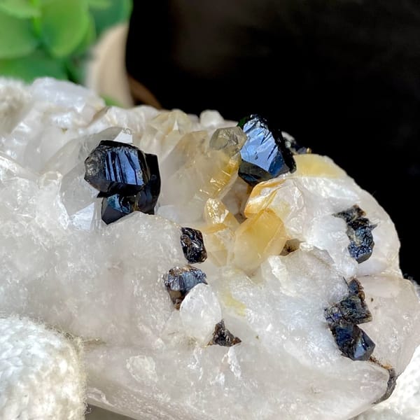 Glossy black cassiterite crystals on white quartz from Yunnan, China, view 3 of 9