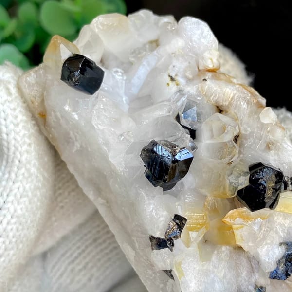 Glossy black cassiterite crystals on white quartz from Yunnan, China, view 6 of 9