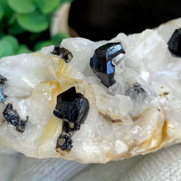Glossy black cassiterite crystals on white quartz from Yunnan, China, view 7 of 9