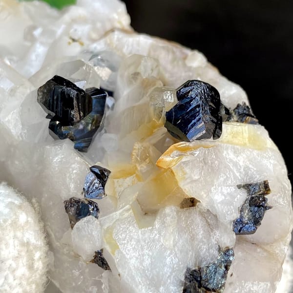 Glossy black cassiterite crystals on white quartz from Yunnan, China, view 8 of 9