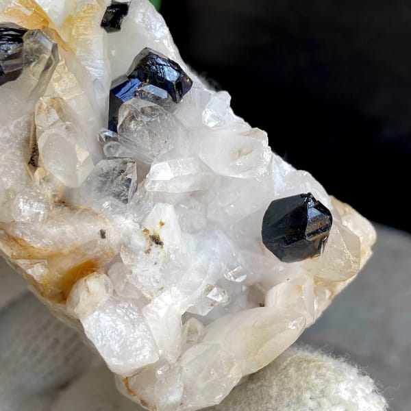 Glossy black cassiterite crystals on white quartz from Yunnan, China, view 9 of 9