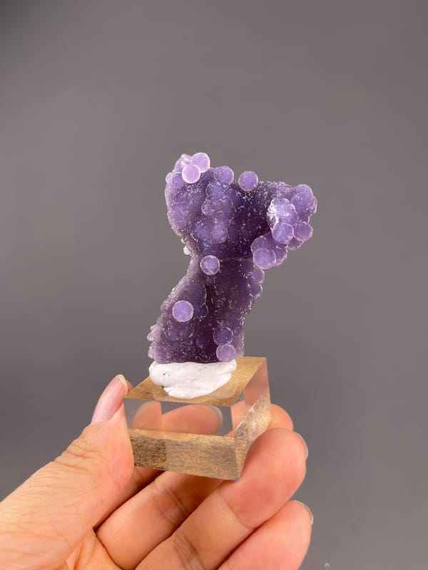 Grape Agate from Indonesia: narrow purple cluster with a curved outline.