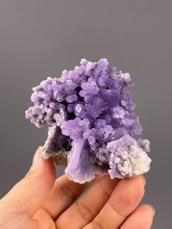 Grape Agate from Indonesia: front view of purple lobes and open cavity.