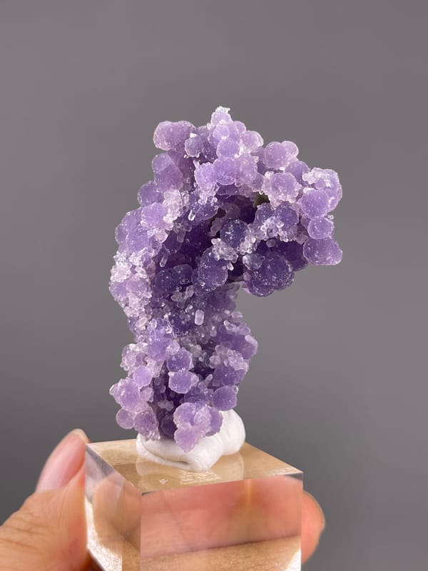 Grape Agate from Indonesia: curved outline with small pale rounded growths.
