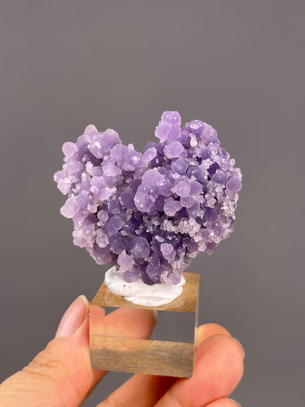 Grape Agate from Indonesia: whole mounted heart-like purple cluster.