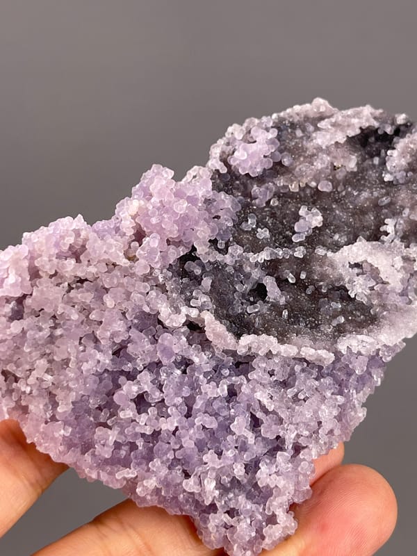 Grape Agate from Indonesia: open cavity along an irregular edge.